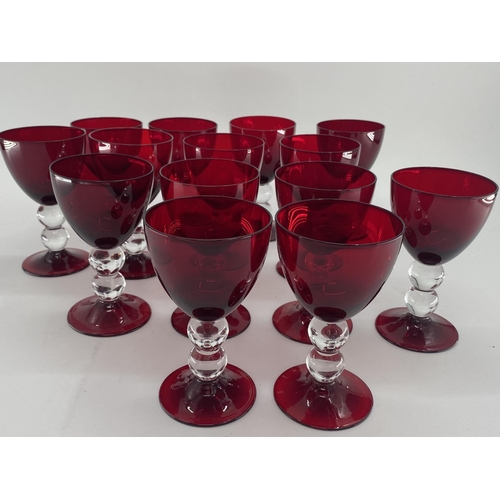 161 - Collection of cranberry glass glasses by Thomas Goode to include 14 white wine, 14 red wine glasses