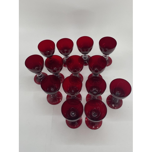 161 - Collection of cranberry glass glasses by Thomas Goode to include 14 white wine, 14 red wine glasses