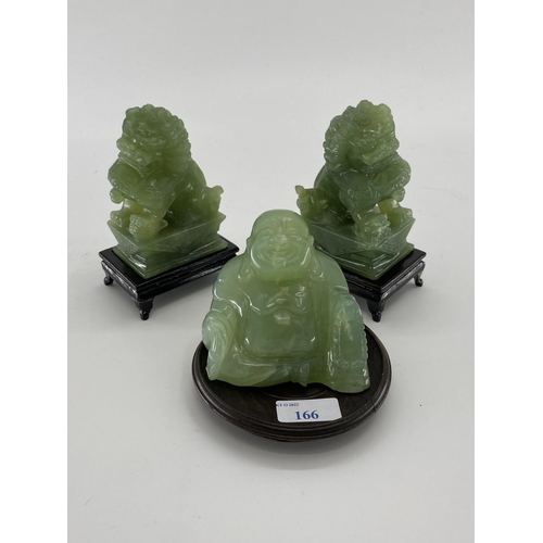 166 - Pair of C20th  Jade dogs of fo on hardwood stands, and a jade buddha on circular stand