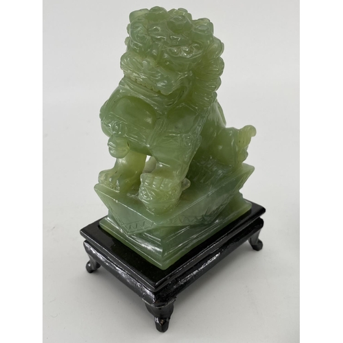 166 - Pair of C20th  Jade dogs of fo on hardwood stands, and a jade buddha on circular stand