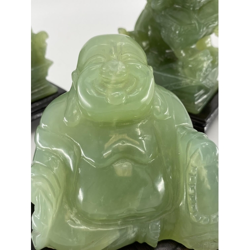 166 - Pair of C20th  Jade dogs of fo on hardwood stands, and a jade buddha on circular stand