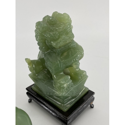 166 - Pair of C20th  Jade dogs of fo on hardwood stands, and a jade buddha on circular stand