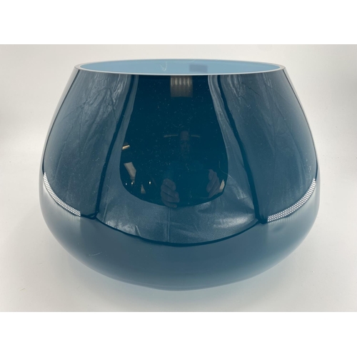 169 - A large Art Glass table centre bowl, with blue exterior. 30cm H x 44cm at widest point