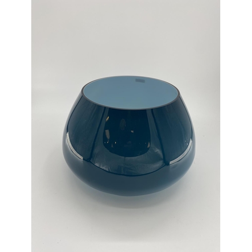 169 - A large Art Glass table centre bowl, with blue exterior. 30cm H x 44cm at widest point