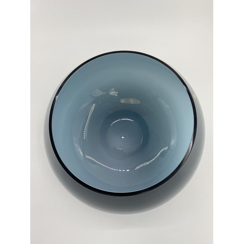 169 - A large Art Glass table centre bowl, with blue exterior. 30cm H x 44cm at widest point