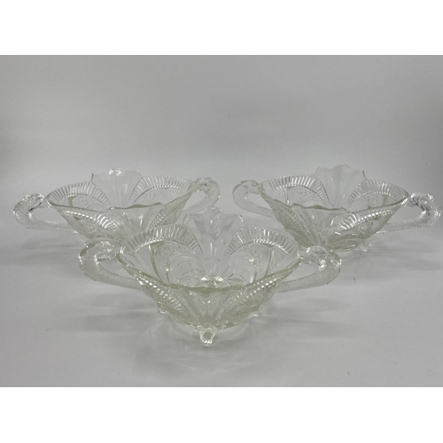 172 - Collection of late C19th early C20th pressed glass items, to include loop handled serving dishes and... 