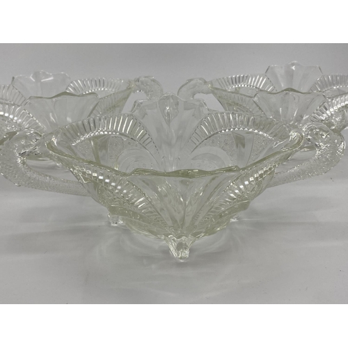 172 - Collection of late C19th early C20th pressed glass items, to include loop handled serving dishes and... 