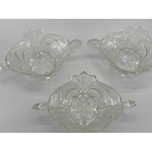 172 - Collection of late C19th early C20th pressed glass items, to include loop handled serving dishes and... 