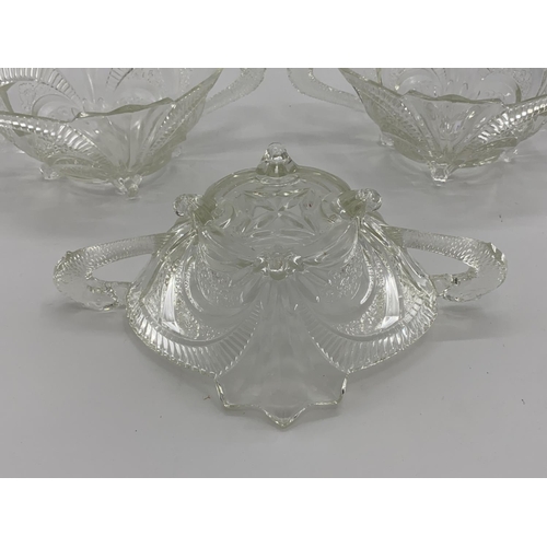 172 - Collection of late C19th early C20th pressed glass items, to include loop handled serving dishes and... 