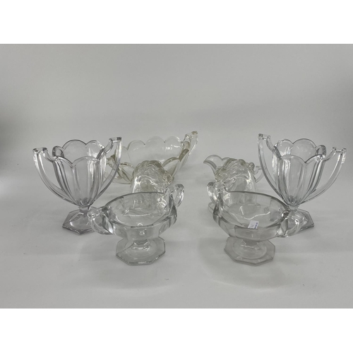 172 - Collection of late C19th early C20th pressed glass items, to include loop handled serving dishes and... 