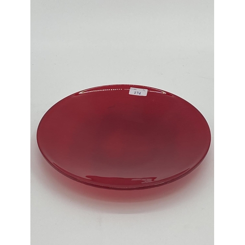 174 - A Nonfoux circular red glass plate, etched and dated to rim 86, approx 31cm diameter