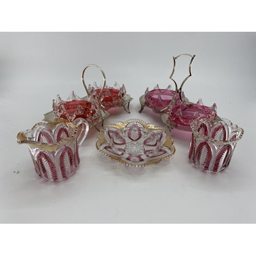 177 - Two cranberry glass and white metal sweet meat serving platters, and two flash cut glass jugs and po... 