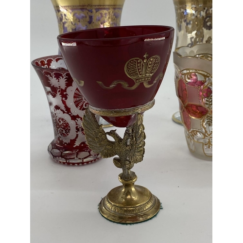 180 - A pair of Moser style gilt goblet, and a some Bohemian style flash cut glass items