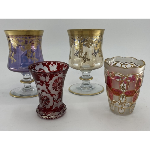 180 - A pair of Moser style gilt goblet, and a some Bohemian style flash cut glass items