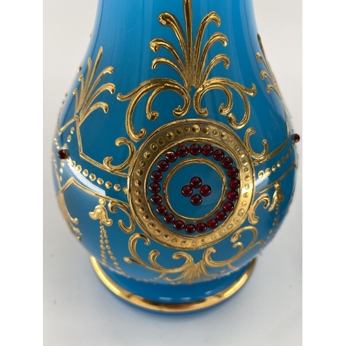 188 - A pair of French Opaline blue and gilt jewelled decorated vases and one other 31cm H. Condition: One... 