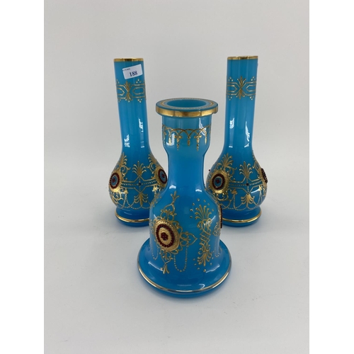 188 - A pair of French Opaline blue and gilt jewelled decorated vases and one other 31cm H. Condition: One... 