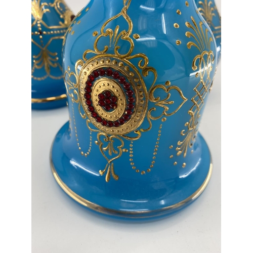 188 - A pair of French Opaline blue and gilt jewelled decorated vases and one other 31cm H. Condition: One... 