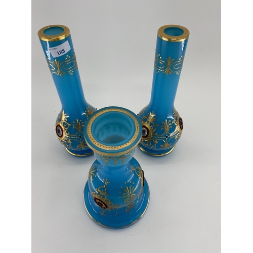 188 - A pair of French Opaline blue and gilt jewelled decorated vases and one other 31cm H. Condition: One... 