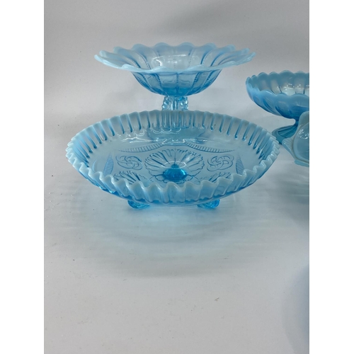 191 - A collection of blue Vaseline/opaline glass items to include footed glass bowls (7)