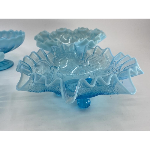 191 - A collection of blue Vaseline/opaline glass items to include footed glass bowls (7)