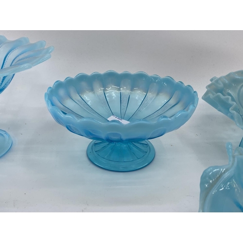 191 - A collection of blue Vaseline/opaline glass items to include footed glass bowls (7)