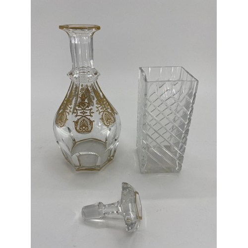 193 - A Baccarat glass decanter with gilt decoration marked to base 30cm, together with a square Baccarat ... 