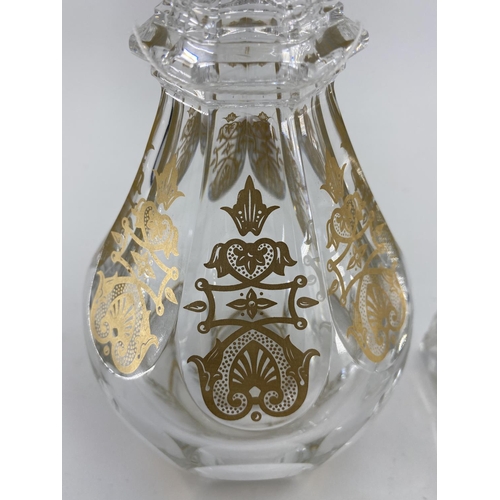 193 - A Baccarat glass decanter with gilt decoration marked to base 30cm, together with a square Baccarat ... 