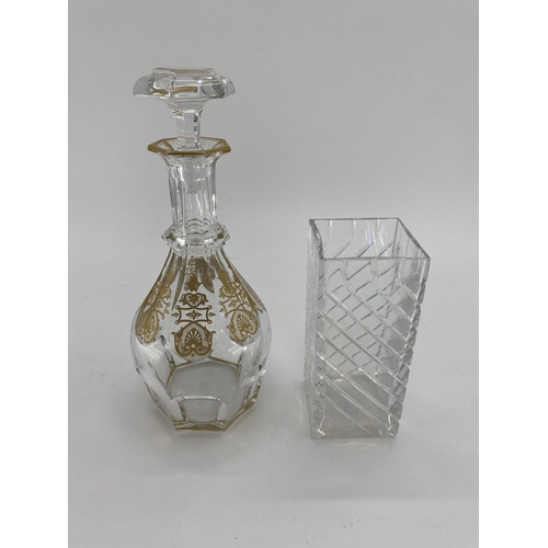 193 - A Baccarat glass decanter with gilt decoration marked to base 30cm, together with a square Baccarat ... 