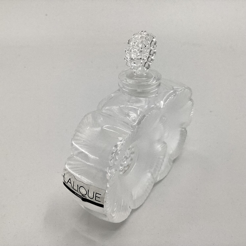 195 - A Lalique frosted glass perfume bottle of twin flower head design etched to base in original box, 10... 