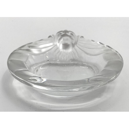 199 - A pair of Lalique frosted glass lion dishes no 10743 etched to base Lalique France, 14.5 cm (d). Con... 