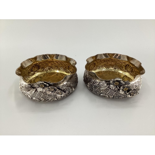 2 - A pair of Turkish silver bowls with cast floral decoration and gilt interior marked Melda Special 90... 