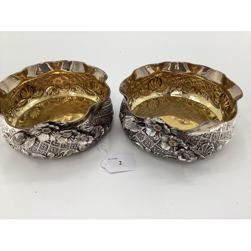 2 - A pair of Turkish silver bowls with cast floral decoration and gilt interior marked Melda Special 90... 