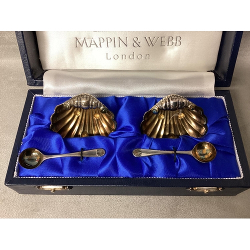 22 - Boxed pair of sterling silver salts and spoons of shell design by Mappin & Webb, London