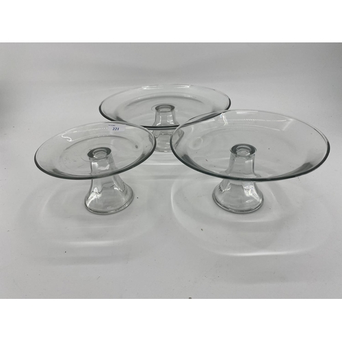 221 - Quantity of glass including modern cake platters on stands, cut glass decanters, wine glasses, tumbl... 