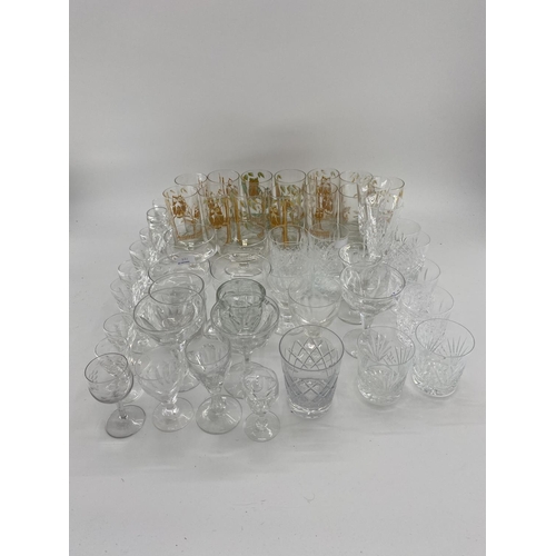 221 - Quantity of glass including modern cake platters on stands, cut glass decanters, wine glasses, tumbl... 