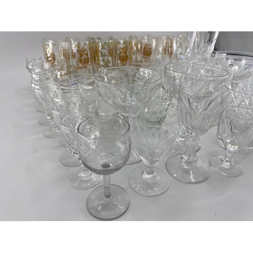 221 - Quantity of glass including modern cake platters on stands, cut glass decanters, wine glasses, tumbl... 