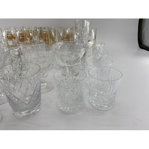 221 - Quantity of glass including modern cake platters on stands, cut glass decanters, wine glasses, tumbl... 