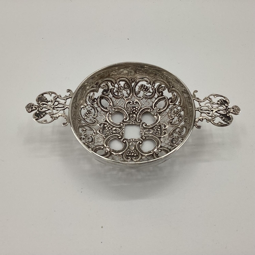 24 - Sterling silver two handled pierced bowl strainer, London 1899, 86g