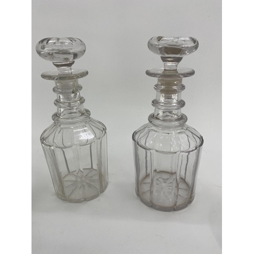 246 - A Stirling silver topped wine carafe together with a white metal topped glass claret jugs, and other... 