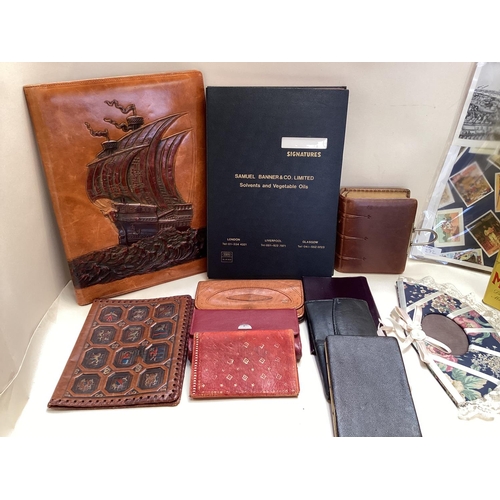 272 - Quantity of advertising tins and 4 posters ; and a quantity of leather goods including blotters, alb... 