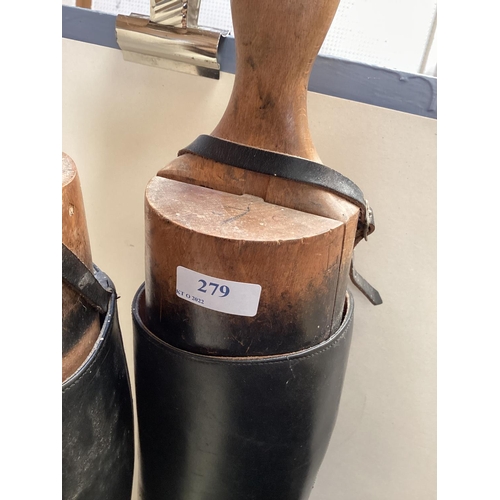 279 - Pair of black leather riding boots with trees, a ladies navy hunting coat by Golding of Newmarket, a... 