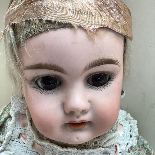 286 - Later C19th/early C20th Continental Bisque headed doll, with open glass eyes glass and mouth, with p... 