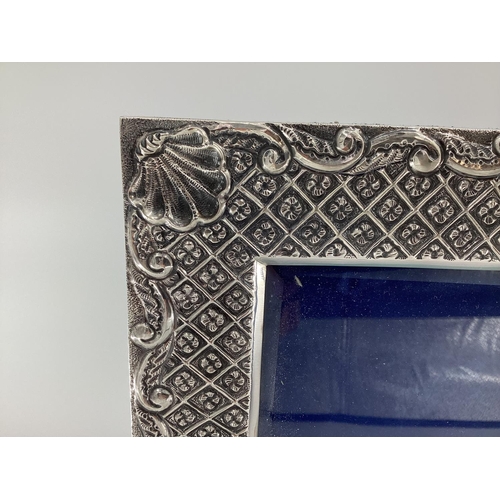 29 - Pair of Turkish silver easel backed picture frames with shell and geometric design stamped Melda Spe... 