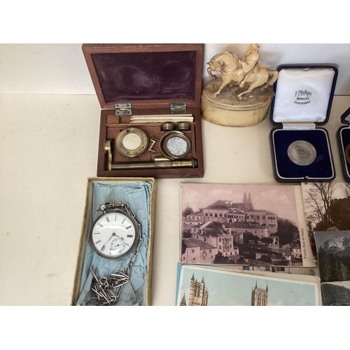 324 - A mixed lot of postcards, coins, watches scales etc and a sterling silver key wind pocket watch, by ... 