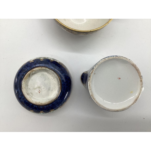 338 - A C19th Derby style part tea set , blue ground with gilt decoration with hand painted panels of flor... 