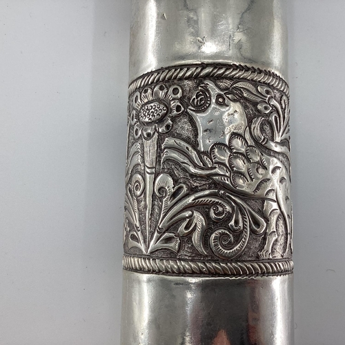 34 - A Middle Eastern style white metal prayer scroll with raised flora and fauna decoration, 30cm, 465gr... 