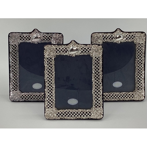 39 - Trio of Sterling silver picture frames with pierced decoration by Keyfold Frames, Ltd, London 1991, ... 