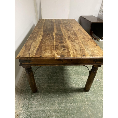 468 - A large teak style rectangular table (one loose leg - needs attention)