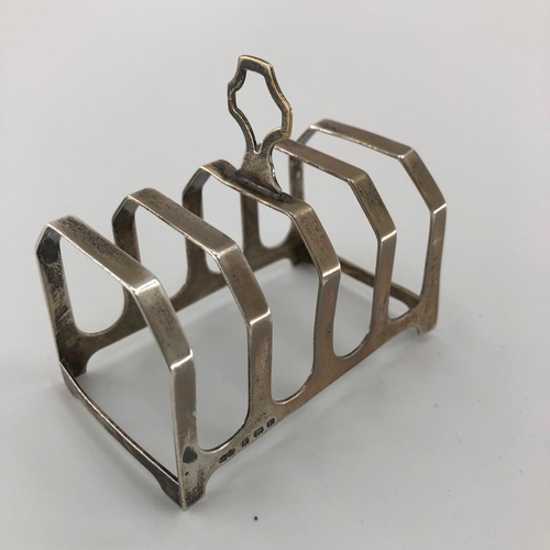 49 - A Sterling Silver toast rack with a mixed selection of Sterling cutlery an  oval plated galleried tr... 