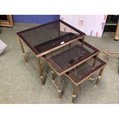 495 - Nest of 3 glass and yellow metal tables (glass damaged), and a side table